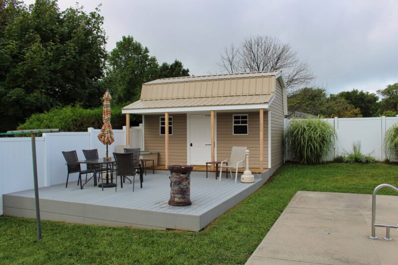 quality prefab sheds with porches for sale near franklin county ohio - beige and white retreat shed on concrete bordered with green grass